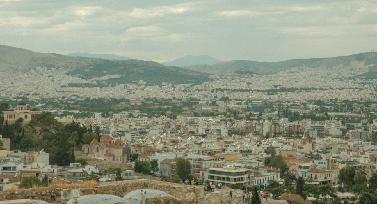 a view of a city from the top of a hill