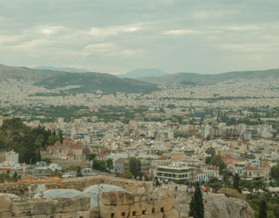 a view of a city from the top of a hill